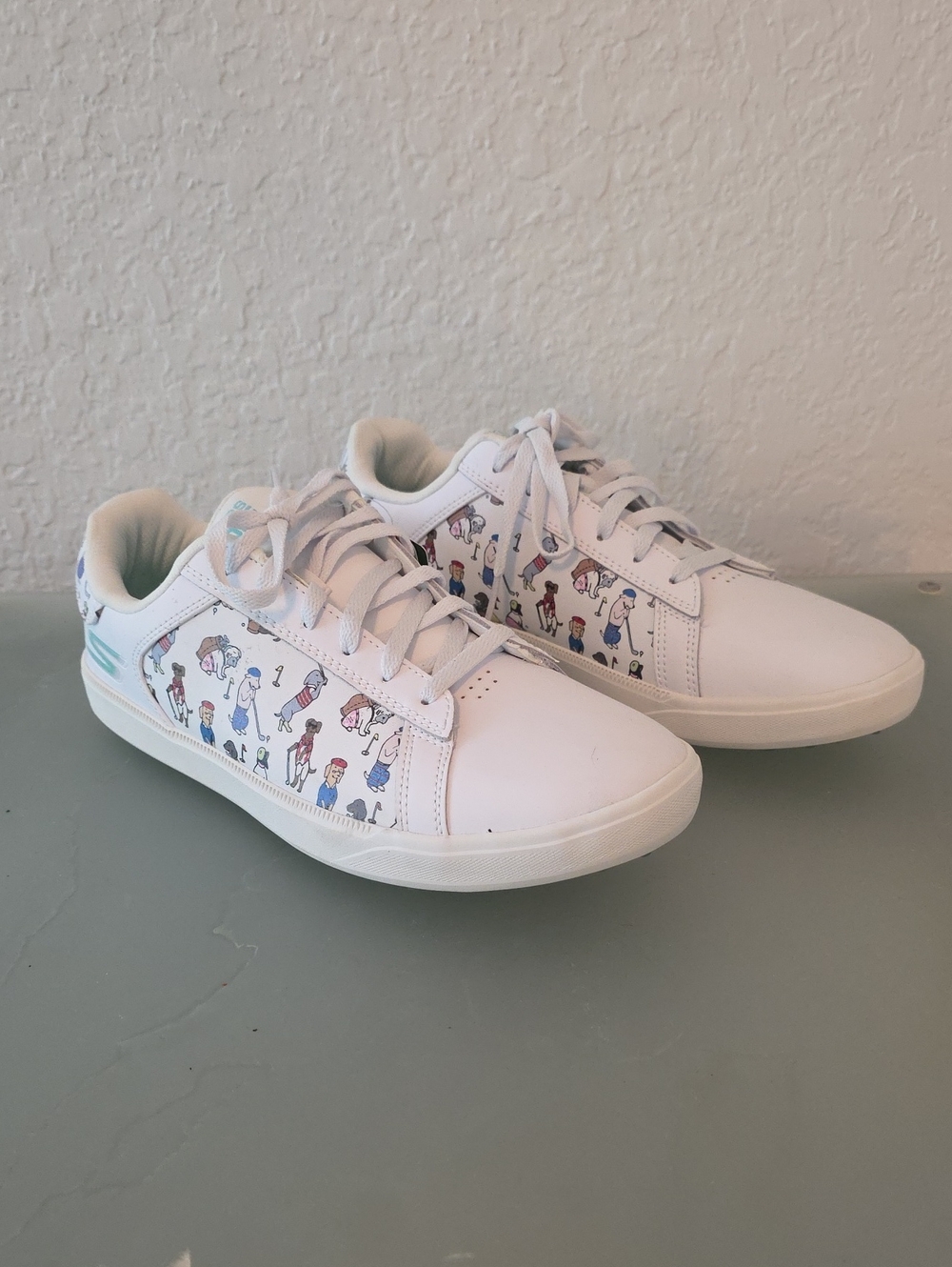 Skechers White Low-Top Golf Sneakers with Multicolor Character Print